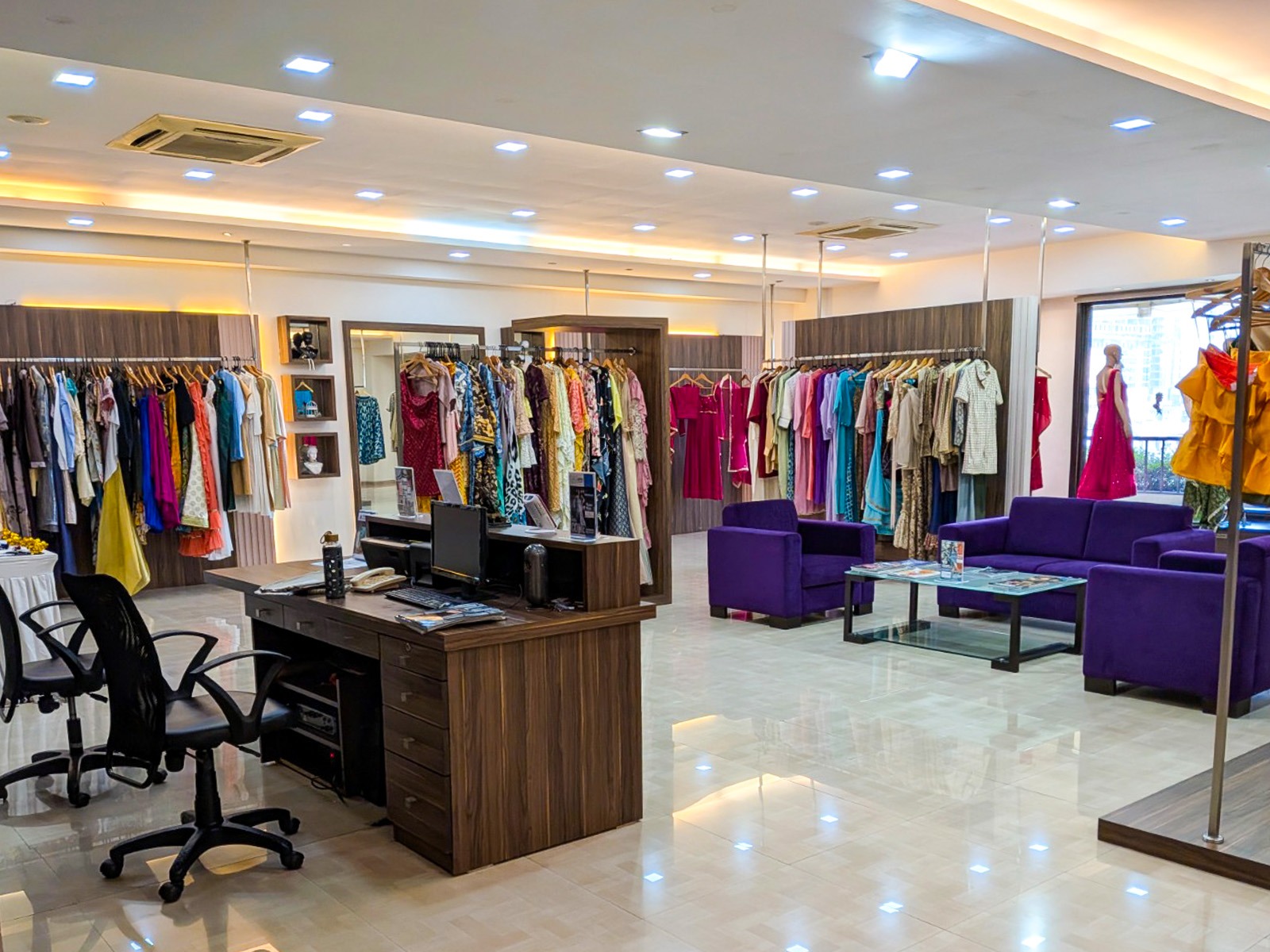 Inside the Tangerine boutique, with fashion displays and a seating area